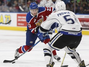 Edmonton's Colton Kehler (23) shoots past Victoria's Mitchell Prowse during the second period of a WHL game between the Edmonton Oil Kings and the Victoria Royals at Rogers Place in Edmonton on Wednesday, October 18, 2017.