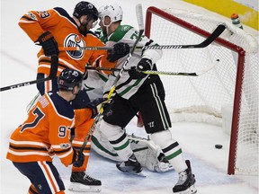 Edmonton Oilers Leon Draisaitl (29) and Connor McDavid (97) watch a goal scored by Patrick Maroon (19) slide past on Dallas Stars goalie Ben Bishop (30) during first period NHL action on Thursday October 26, 2017, in Edmonton.