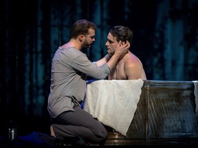 Zachary Read, left, as the Young Simon and Jean-Michel Richer, right, as Vallier in Edmonton Opera's production of Kevin March's opera Lilies (Les Feluettes), which opened at the Jubilee on Saturday.