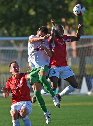 FC Edmonton Sainey Nyassi (14) and New York Cosmos Pablo Vranjican (31) for up for the header during NASL action at Clarke Stadium in Edmonton, July 15, 2017. Ed Kaiser/Postmedia