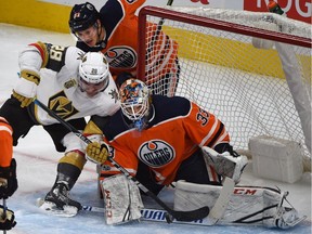 Vegas Golden Knights forward William Carrier can't get the puck past Edmonton Oilers goalie Cam Talbot as defenceman Matthew Benning trails behind during NHL action at Rogers Place on Nov. 14, 2017.