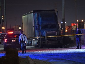 Police on the scene where a male body was found behind this truck trailer unit next to the yard of Alberta Plywood at 9923 65 Ave. and police are following a trail along the railway track (in back) in Edmonton,November 19, 2017. Ed Kaiser/Postmedia For Catherine Griwkowsky story running Monday, Nov. 20
Ed Kaiser Ed Kaiser, Ed Kaiser/Postmedia