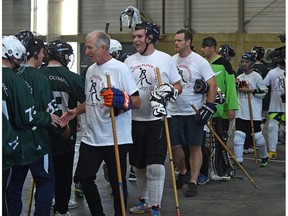 Oilers Alumni Team shake hands after facing off with the Special Olympics athletes (green) during the annual Floor Hockey Invitational tournament along with over 300 athletes from Alberta at the Expo Centre in Edmonton,November 25, 2017. Ed Kaiser/Postmedia Ed Kaiser Ed Kaiser, Ed Kaiser/Postmedia