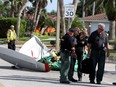 The tail section of an ICON A5 ultralight airplane lay on a roadway near a boat ramp in the Gulf Harbors neighborhood of New Port Richey, Fla., on Nov. 8, 2017