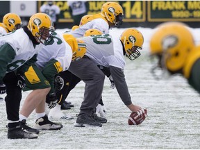 The Edmonton Eskimos offensive line takes part in an Edmonton Eskimos' team practice at Commonwealth Stadium, in Edmonton Wednesday Nov. 8, 2017.