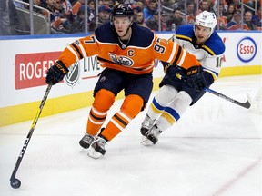 Edmonton Oilers' Connor McDavid (97) battles St. Louis Blues' Brayden Schenn (10) during first period NHL action at Rogers Palce in Edmonton Thursday Nov. 16, 2017.