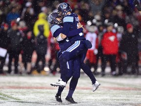 Toronto Argonauts kicker Lirim Hajrullahu celebrates his field goal with backup quarterback Cody Fajardo during the Grey Cup on Nov. 26, 2017