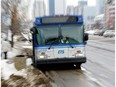 Edmonton transit buses make their way along 104 Avenue. File photo