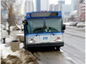 Edmonton transit buses make their way along 104 Avenue. File photo