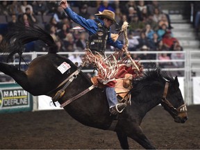 Layton Green, from Meeting Creek, AB scores 81.25 in the saddle bronc riding event during the 44th Canadian Finals Rodeo at Northlands Coliseum in Edmonton, November 8, 2017.