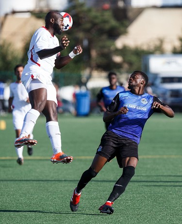 Edmonton's Tomi Ameobi looks on as San Francisco's Nana Attakora heads the ball during FC Edmonton's NASL soccer game against the San Francisco Deltas at Clarke Stadium in Edmonton, Alta., on Saturday, June 24, 2017. (Codie McLachlan/Postmedia)