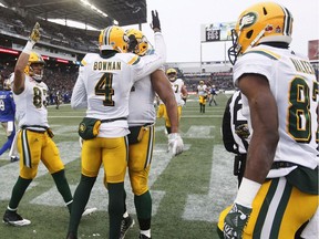 Edmonton Eskimos' Brandon Zylstra (83), Adarius Bowman (4), Joel Figueroa (61) and Derel Walker (87) celebrate Bowman's touchdown against the Winnipeg Blue Bombers during first half CFL western semifinal action in Winnipeg on Nov. 12, 2017.