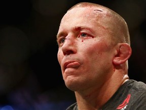 Georges St-Pierre reacts following his UFC 217 victory over Michael Bisping