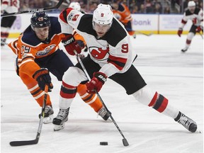 New Jersey Devils' Taylor Hall (9) is chased by Edmonton Oilers' Leon Draisaitl (29) during first period NHL action in Edmonton on Friday, November 3, 2017.
