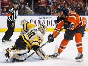 Pittsburgh Penguins goalie Matt Murray makes the save on Edmonton Oilers forward Zack Kassian during NHL action in Edmonton on Nov. 1, 2017.