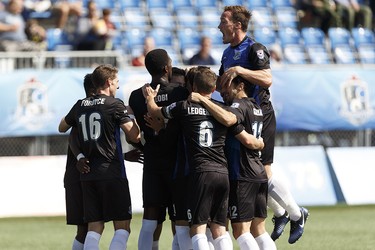 FC Edmonton players celebrate Ben Fisk's (9) goal on Puerto Rico FC during an NASL soccer game at Clarke Stadium in Edmonton, Alberta on Sunday, August 20, 2017.