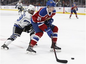 Edmonton's Brett Kemp (24) battles Victoria's Dante Hannoun (19) during the second period of a WHL game between the Edmonton Oil Kings and the Victoria Royals at Rogers Place in Edmonton, Alberta on Wednesday, October 18, 2017.