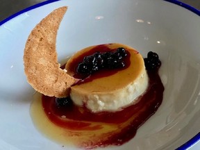 Creme Caramel with saskatoon berry compote.