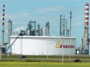 Stacks from the Petro-Canada Refinery rise above the Enbridge Oil Tank Farm in Sherwood Park, Ab.