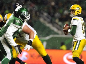 Edmonton Eskimos quarterback Mike Reilly looks for a receiver against the Saskatchewan Roughriders during second half CFL action at Mosaic Stadium in Regina on Saturday, November 4, 2017.