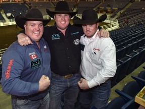 The Milan brothers, from left, Straws, Tanner and Baillie all competing in the steer wrestling event for the first time during the 44th Canadian Finals Rodeo at Northlands Coliseum in Edmonton, November 8, 2017.