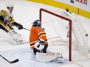 Edmonton Oilers goalie Cam Talbot (33) is scored on by Pittsburgh Penguins Conor Sheary (43) during second period NHL action on Wednesday November 1, 2017, in Edmonton.