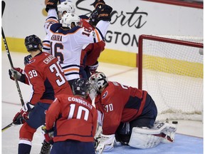 Edmonton Oilers left wing Jujhar Khaira (16) celebrates his goal against Washington Capitals goalie Braden Holtby (70) during the third period of an NHL hockey game, Sunday, Nov. 12, 2017, in Washington. Also seen are Capitals right wings Brett Connolly (10) and Alex Chiasson (39). The Capitals won 2-1 in a shootout.