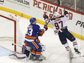 Edmonton Oilers captain Connor McDavid celebrates after scoring the winning goal in overtime  of an NHL hockey game against the New York Islanders in Brooklyn, N.Y., on Nov. 7, 2017.