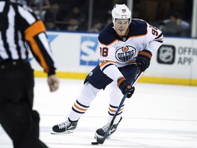 Edmonton Oilers right wing Jesse Puljujarvi controls the puck during the first period of an NHL hockey game against the New York Rangers, Saturday, Nov. 11, 2017, in New York.