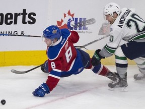 Edmonton Oil Kings Ethan Cap is tripped by Seattle Thunderbirds Zack Andrusiak during first period WHL action on Thursday November 2, 2017, in Edmonton.