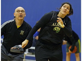 University of Alberta Pandas head coach Scott Edwards (left) and forward Elle Hendershot (right) at team practice in Edmonton on November 29, 2017.