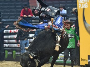 Tanner Byrne riding the bull named Cuckoo Kong during the PBR Global Cup qualifying round at Rogers Place in Edmonton, November 9, 2017.