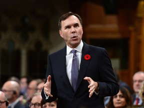 Minister of Finance Bill Morneau stands during question period in the House of Commons on Parliament Hill in Ottawa.