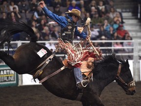 Layton Green, from Meeting Creek, AB scores 81.25 in the saddle bronc riding event during the 44th Canadian Finals Rodeo at Northlands Coliseum in Edmonton, November 8, 2017.