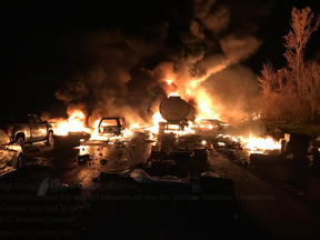 Vehicles burn on Hwy. 400 south of Barrie on Wednesday, Nov. 1, 2017.