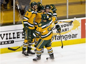 The Alberta Golden Bears' celebrate Jamie Crooks (10) short-handed goal against the Mount Royal Cougars during first period Canada West action at Clare Drake Arena, in Edmonton Friday Oct. 6, 2017.