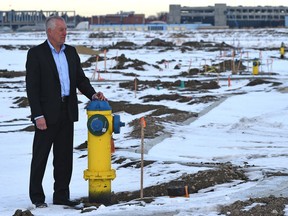 Blatchford development manager Mark Hall surveys the site of the future community on the old airport lands Monday. About 8.4 km of underground utilities have been laid to date, including water lines for fire hydrants.