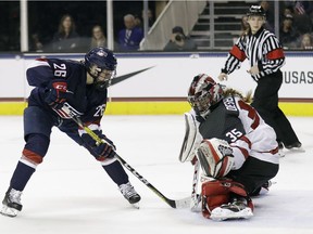 Canada goalie Ann-Renee Desbiens, right, stops a shot from United States' Kendall Coyne during the second period of a women's hockey game Friday, Dec. 15, 2017, in San Jose, Calif.