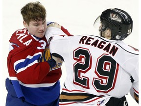 Oil Kings forward Ty Gerla gets into it with the Calgary Hitmen's Brady Reagan during a previous meeting at the Scotiabank Saddledome in Calgary on February 17, 2017. Calgary defeated Edmonton 6-1 there on Wednesday. (File)