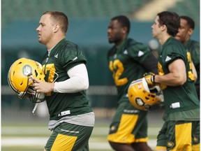 Edmonton's JC Sherritt (left) and others run during Edmonton Eskimos practice at Commonwealth Stadium in Edmonton, Alberta on Thursday, Aug. 18, 2016.