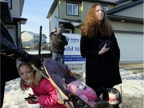 Leanne Kirk and her daughter Zoey, 7, outside their new Habitat For Humanity home in Fort Saskatchewan on Thursday, Dec. 14, 2017. Six of the 16 Habitat for Humanity homes in Fort Saskatchewan have now been complete and families are ready to move in.