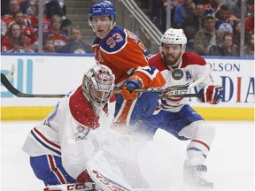 Montreal Canadiens goalie Carey Price (31) makes the save on Edmonton Oilers centre Ryan Nugent-Hopkins (93) as defenceman Shea Weber (6) defends during second period NHL action in Edmonton, Alta., on Sunday March 12, 2017.