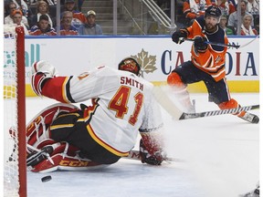 Calgary Flames goalie Mike Smith (41) makes the save on Edmonton Oilers' Patrick Maroon (19) during second period NHL action in Edmonton, Alta., on Wednesday October 4, 2017.