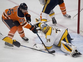 Edmonton Oilers Mark Letestu (55) can't get the puck past Nashville Predators goalie Juuse Saros (74) during first period NHL action on Thursday, Dec. 14, 2017 in Edmonton.