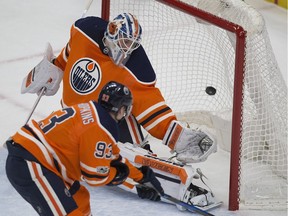 Edmonton Oilers goalie Laurent Brossoit (1) is scored on by Nashville Predators Kyle Turris (8) (not pictued) during second period NHL action on Thursday, Dec. 14, 2017 in Edmonton.