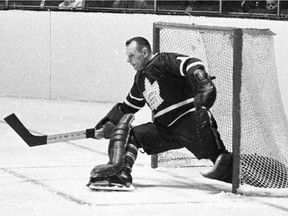 Toronto Maple Leafs' Johnny Bower makes a kick save during a playoff action against The Montreal Canadiens in Montreal in 1966. Bower died at 93.