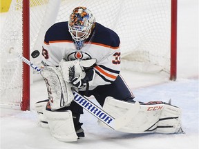 Edmonton Oilers' goalie Cam Talbot (33) blocks a goal attempt by the Minnesota Wild on Saturday, Dec. 16, 2017, in St. Paul, Minn.