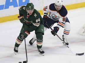 Minnesota Wild’s Mikael Granlund (64) controls the puck against Edmonton Oilers' Johann Auvitu (81) in the first period of an NHL hockey game Saturday, Dec. 16, 2017, in St. Paul, Minn.