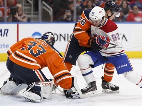 Edmonton's goaltender Cam Talbot (33) makes a save during the second period of a NHL game between the Edmonton Oilers and the Montreal Canadiens in Edmonton on Saturday, December 23, 2017.