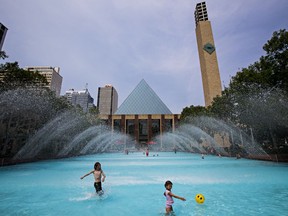 Kids pack the wading pool at City Hall as temperatures soar in Edmonton, Alta., on Tuesday, July 15, 2014.